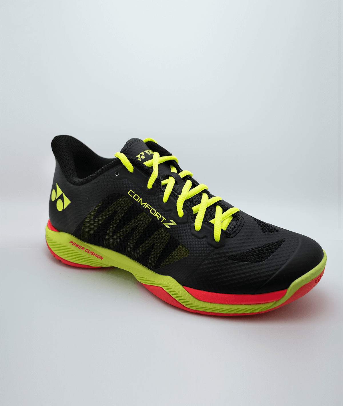 Yonex Power Cushion Comfort Z3 badminton shoe in black with neon yellow laces, lime green sole accents and red trim